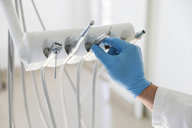 Professional Root Canal Treatment technician working in East Northport, NY
